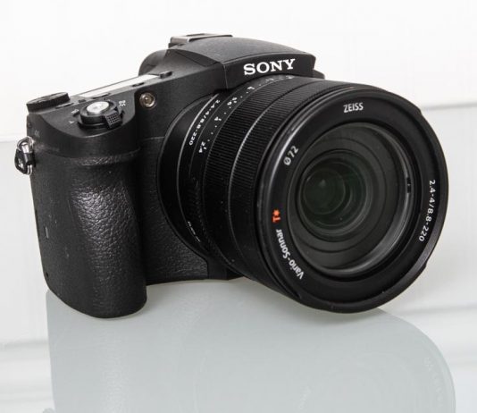 Photo of the Sony RX10 IV on a lgass table