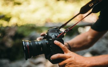 A photo of a videographer shooting video with a Canon 1D