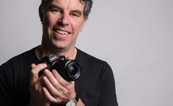 Photographer Justin Morrison holding the Sony a7 III mirrorless camera