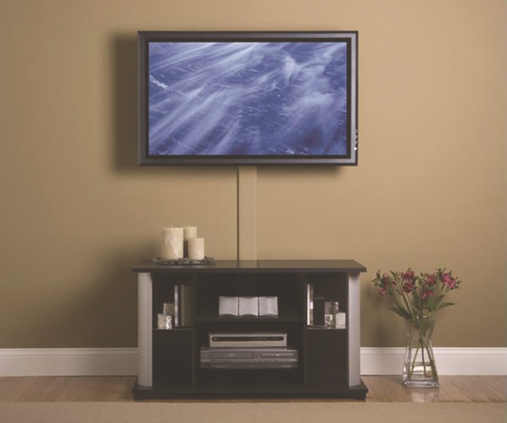 image of a mounted TV with a cable management system; the cables are gathered in a line down the wall and hidden behind a cover