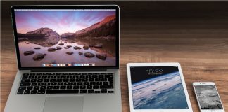 image of a MacBook, iPad, and iPhone in row on a table