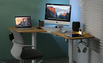 A desk with a computer and monitor set-up.