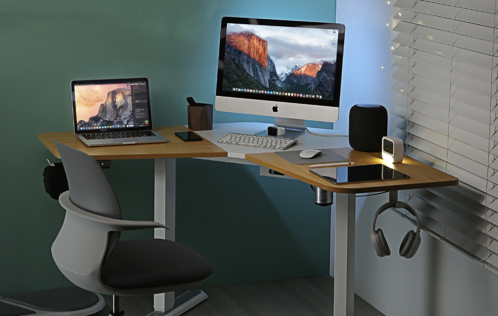 A desk with a computer and monitor set-up.