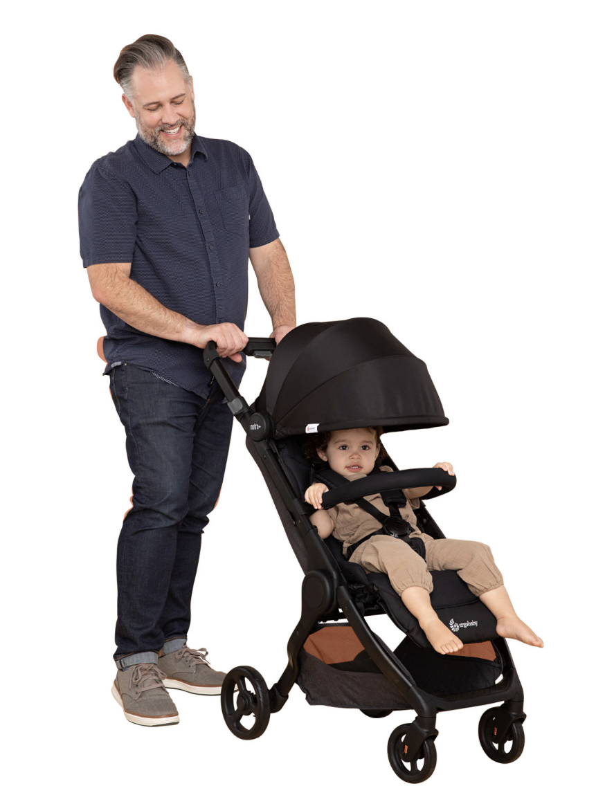 Man pushing child in a standard stroller.