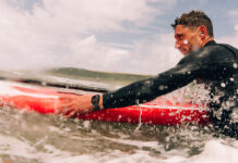 Man surfing while wearing an Apple Watch Series 10