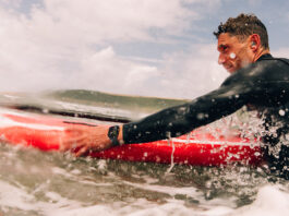 Man surfing while wearing an Apple Watch Series 10