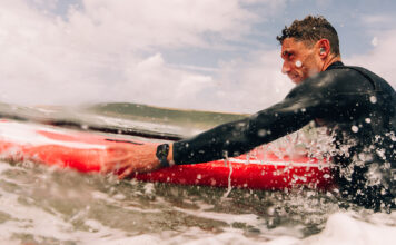 Man surfing while wearing an Apple Watch Series 10