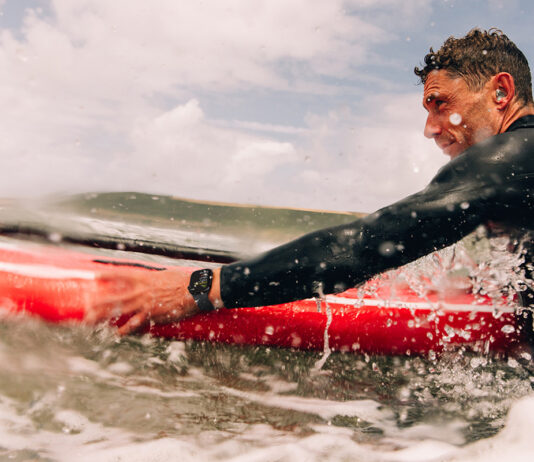 Man surfing while wearing an Apple Watch Series 10