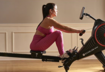 a woman rowing on a machine.
