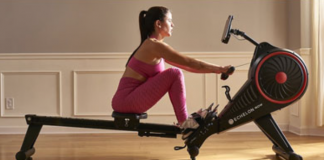a woman rowing on a machine.