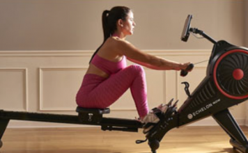 a woman rowing on a machine.