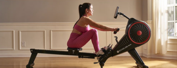 a woman rowing on a machine.