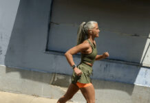 A woman running while wearing the Google Pixel Watch 3.