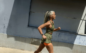 A woman running while wearing the Google Pixel Watch 3.