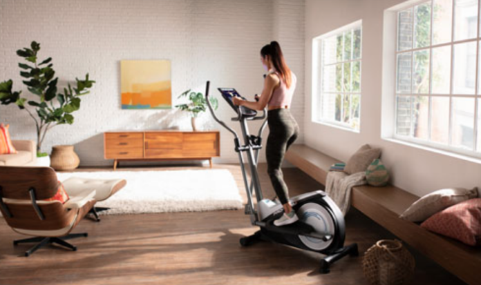 Woman on a Proform Elliptical machine.