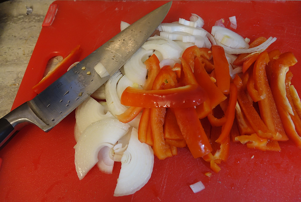 The Cuisinart Chef's knife with cut onions and peppers