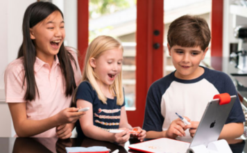 Three kids with the Osmo Starter Kit.