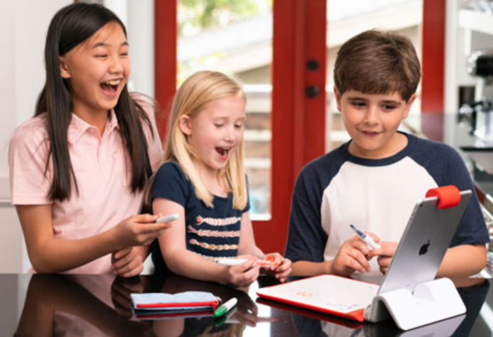 Three kids with the Osmo Starter Kit.