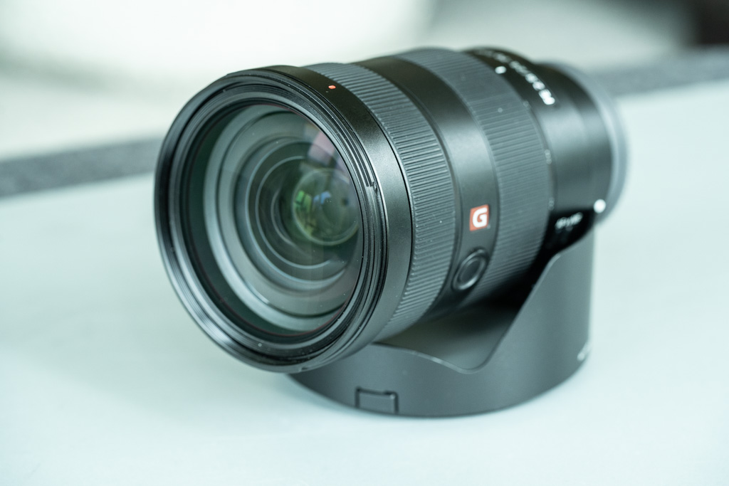 A photo of the Sony FE 24-70mm f/2.8 GM lens lying sideways