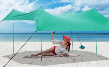 Costway beach sun shade with woman.