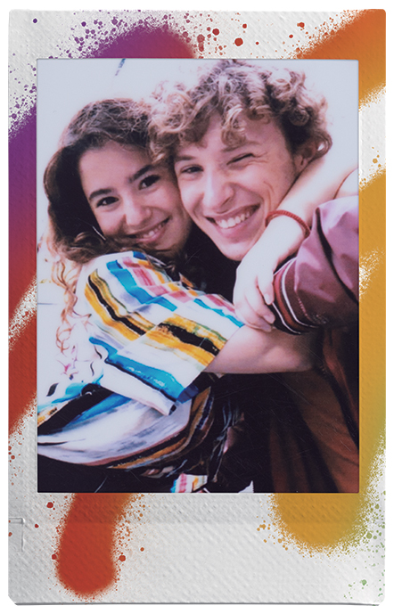 Couple smiling and hugging in a mini photo print