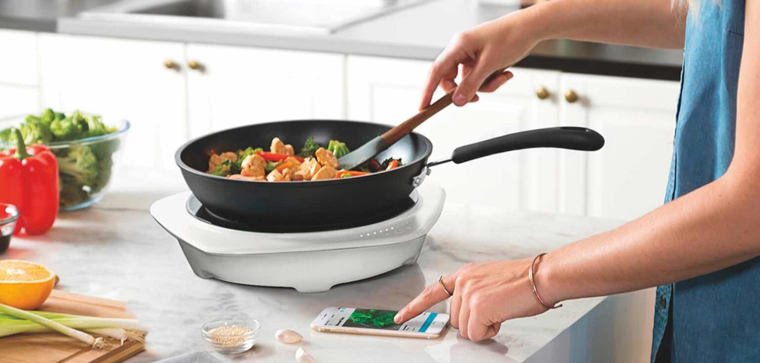 Hands cooking in a pan