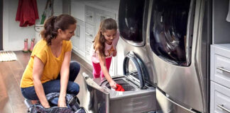 Mom and daughter doing laundry together using LG machines