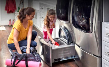 Mom and daughter doing laundry together using LG machines
