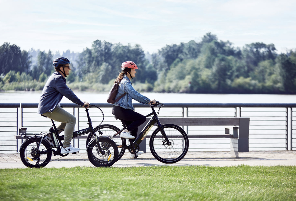 A couple riding Aventon electric bikes