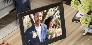 A digital photo frame with the picture of a bride and groom.