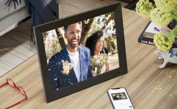 A digital photo frame with the picture of a bride and groom.