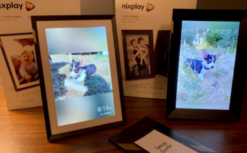 Nixplay Touch 10 New and Classic Side by Side in Portrait mode with the boxes behind them and the tatup manual in frame showing puppy photos