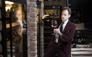 Man pouring a glass of wine.