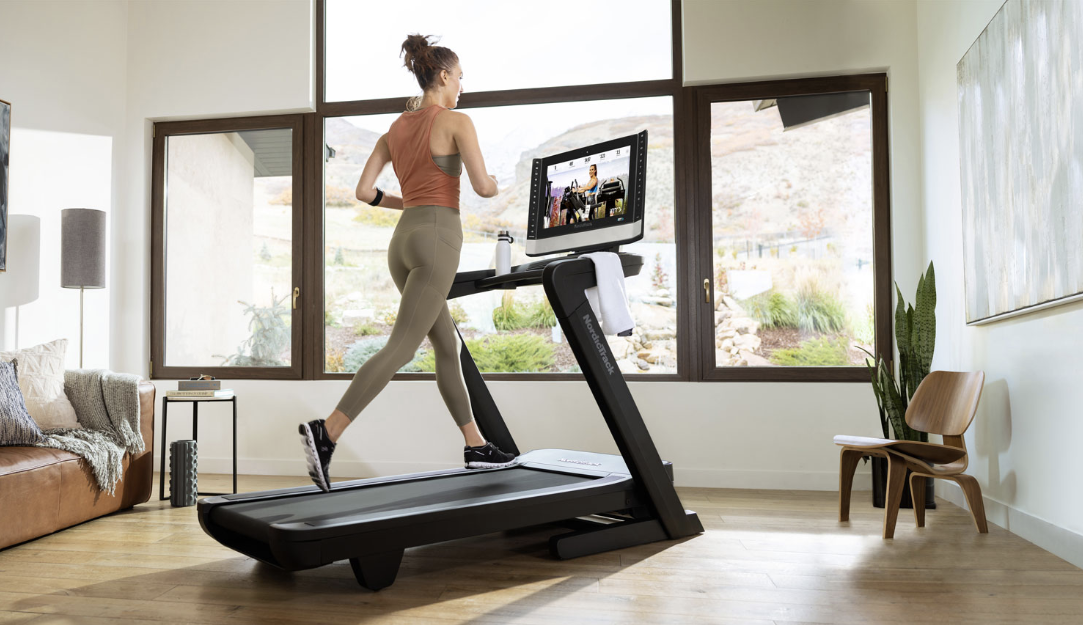 Woman on the Nordictrack folding treadmill