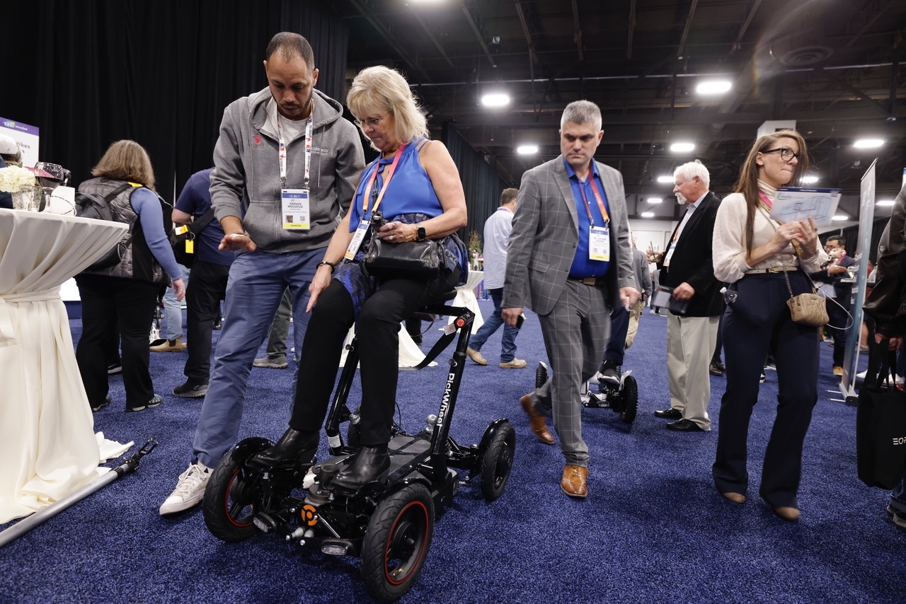 Woman on a mobility device at CES 2023