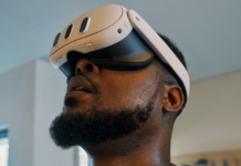 A guy wearing the Meta Quest 3 VR headset.