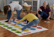 A family playing Twister.