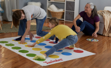 A family playing Twister.