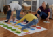 A family playing Twister.