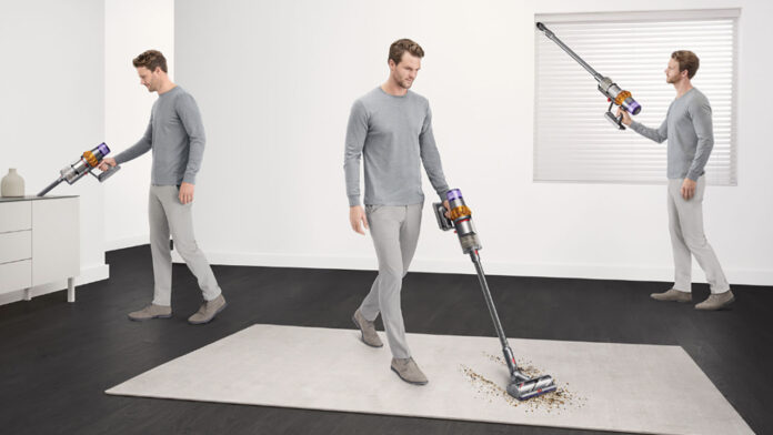A man vacuuming three different areas of a home with a Dyson cordless vacuum.