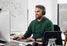 Man working from home with headphones on