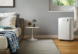 De'Longhi Pinguino portable air conditioner keeps a bedroom cool.