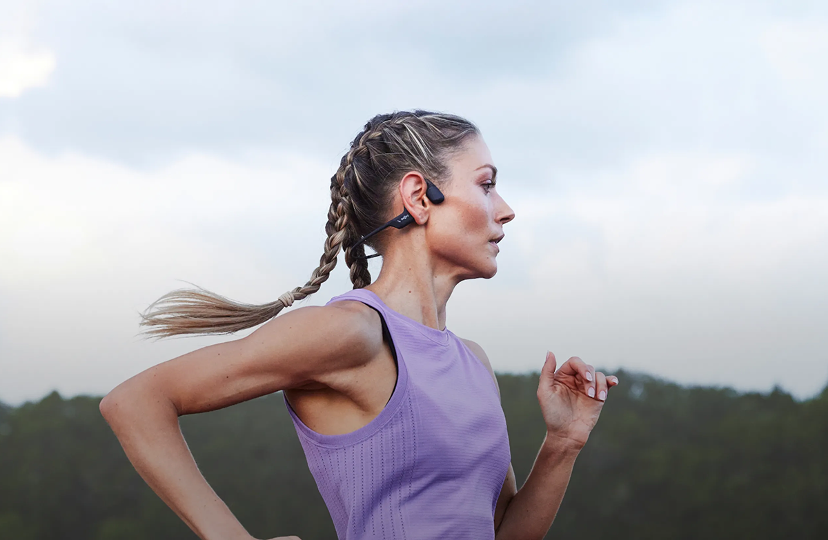 Woman wearing bone conduction headphones