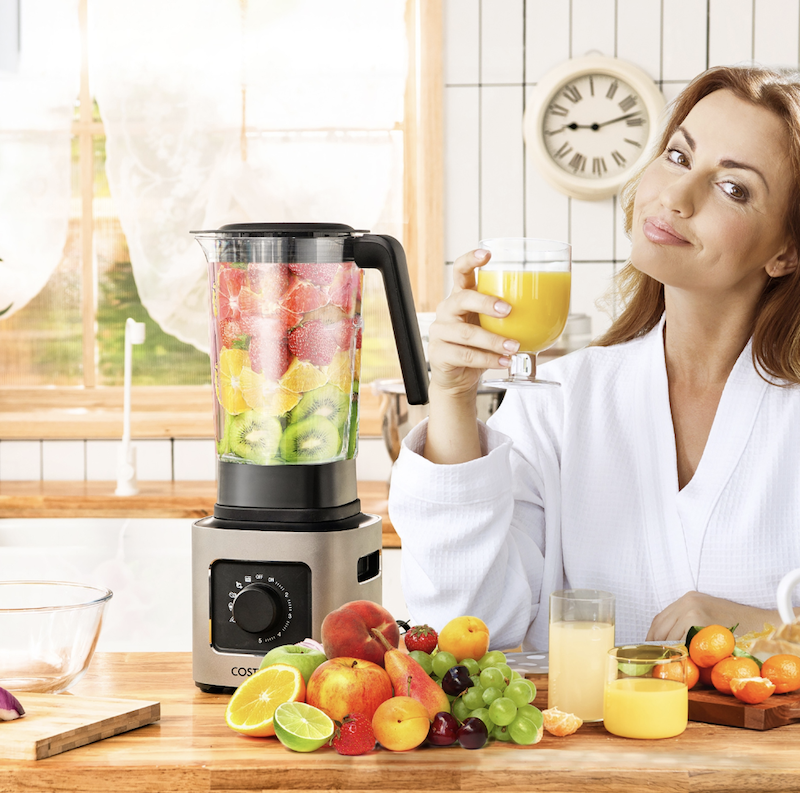 Woman with a smoothie and Costway blender
