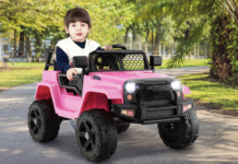 Child in Costway ride-on car.