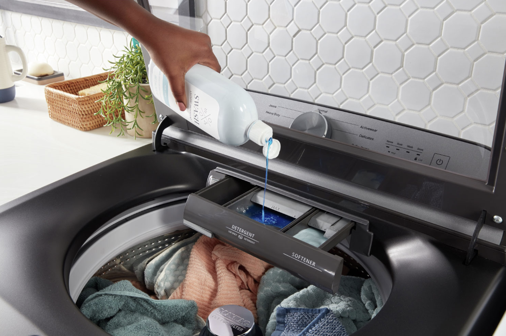 Pouring detergent into the Maytag Pet Pro washer