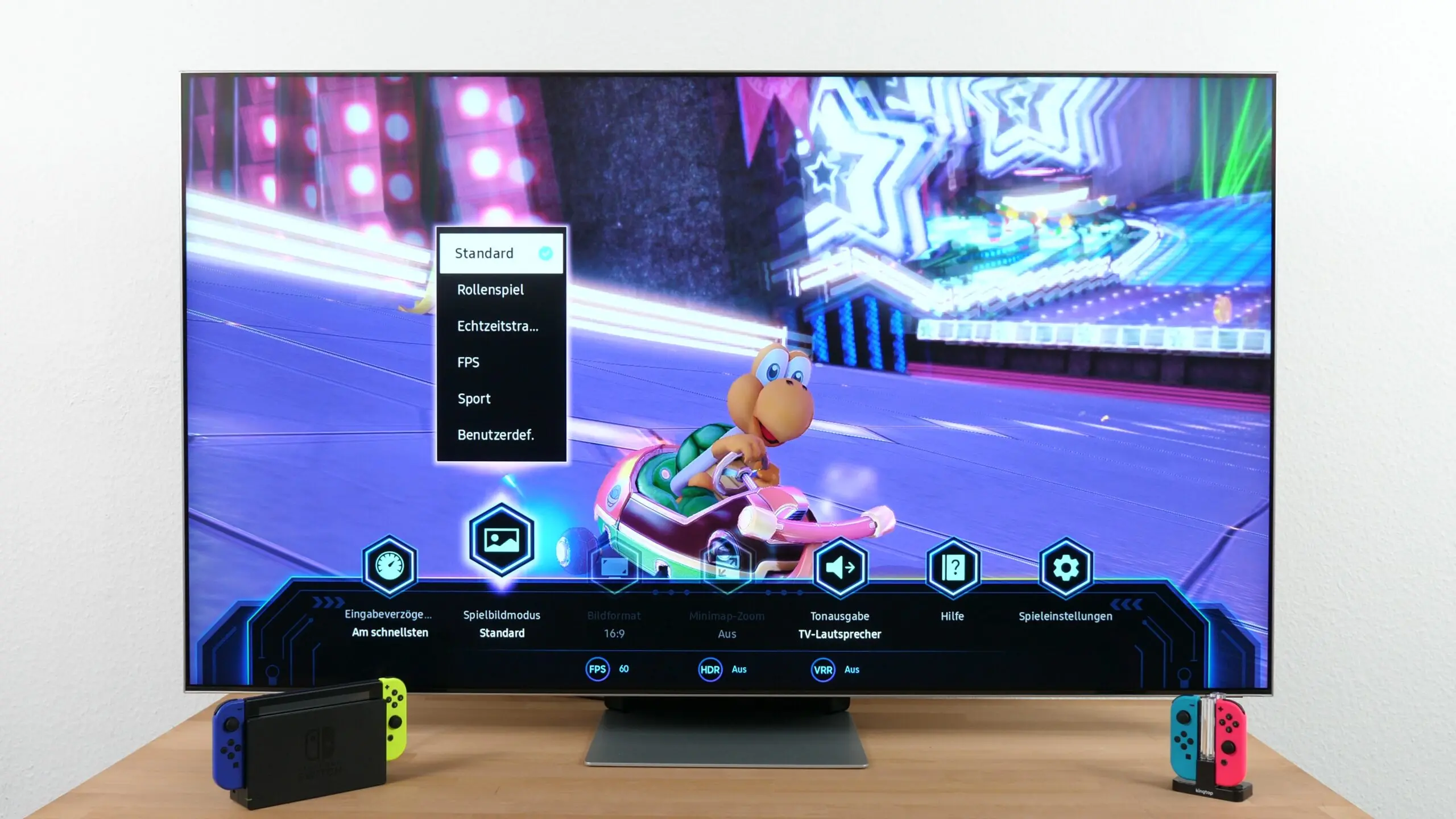 A Samsung Gaming TV showing off it's display menu with options for better FPS and other settings while playing Mario Kart