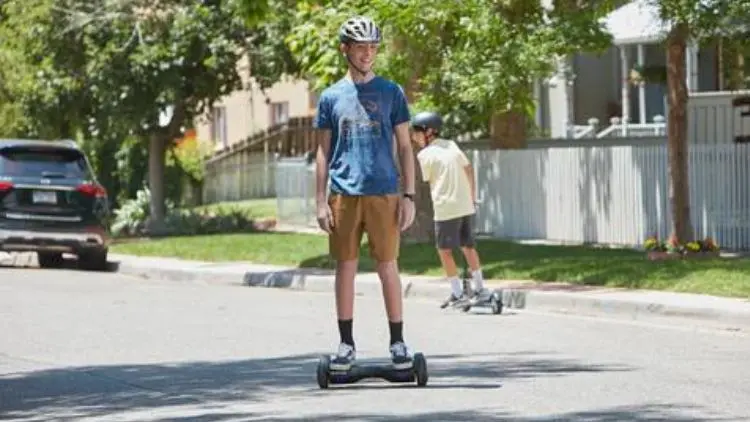 Teenage boy riding a hoverboard