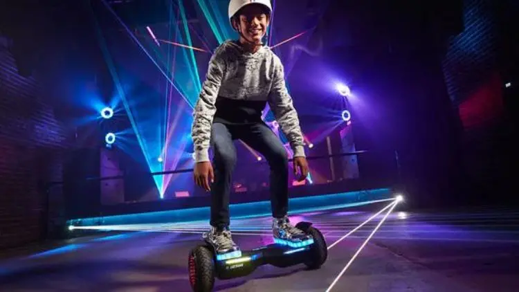 Young boy riding a hoverboard