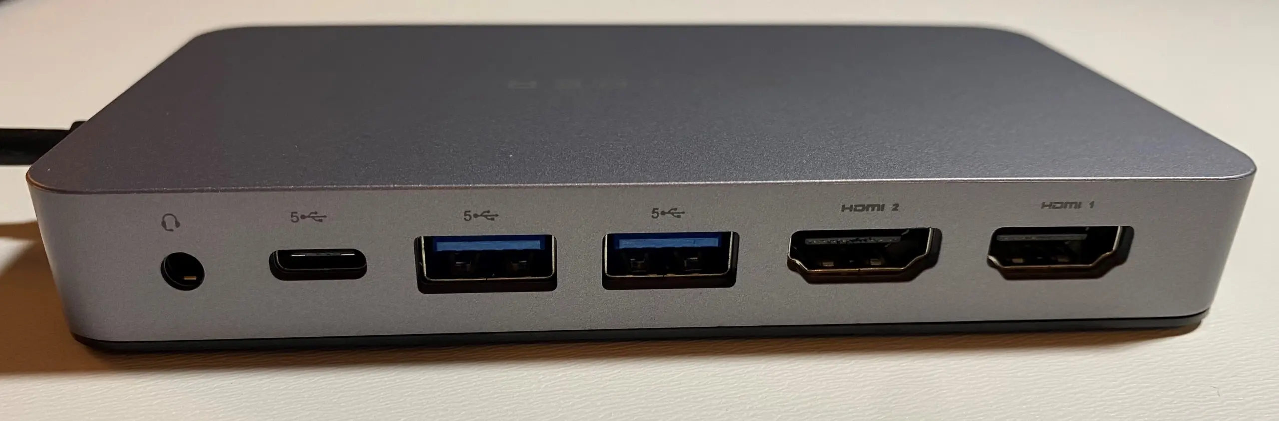 Some of the ports of the HypeDrive dock on it's side, showing dual HDMI, dual USB-C, USB-A and a 3.5mm headphone jack